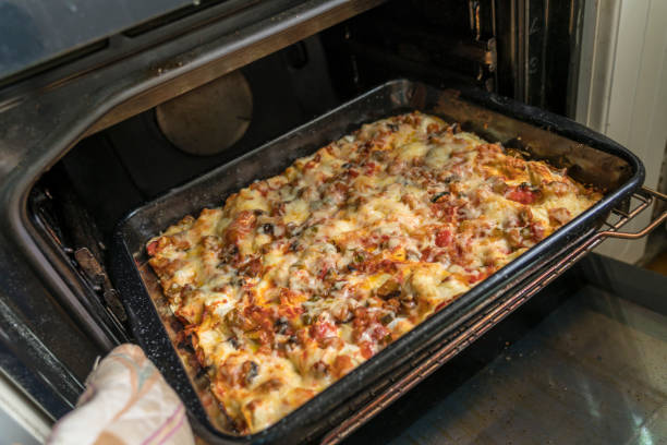 Close-up of lasagna in the window of a cafe shop.