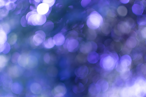 Cool abstract background with lots of small bokeh in blue tones. Winter theme. Backdrop