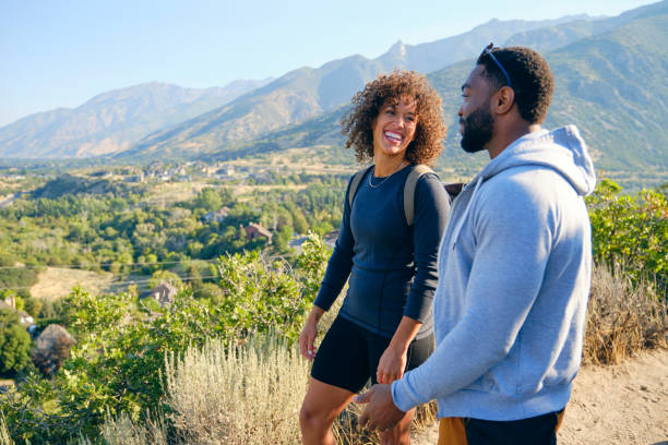 istock Young Couple Hiking in the Mountains 1423417532
