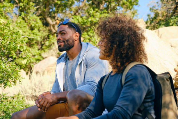 istock Young Couple Hiking in the Mountains 1423417559