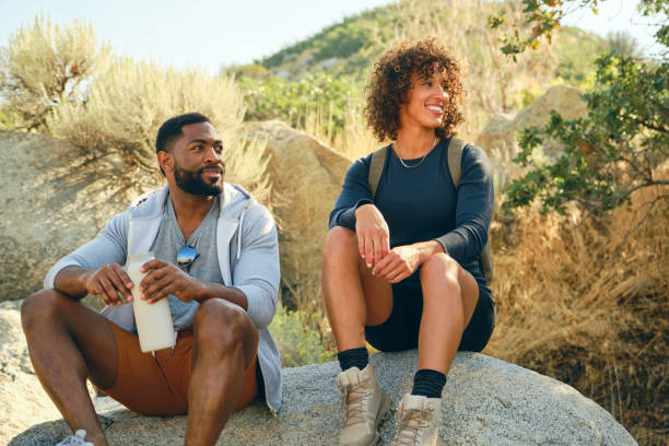 istock Young Couple Hiking in the Mountains 1423418242