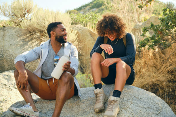 istock Young Couple Hiking in the Mountains 1423418246