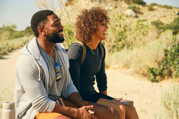 istock Young Couple Hiking in the Mountains 1423418251