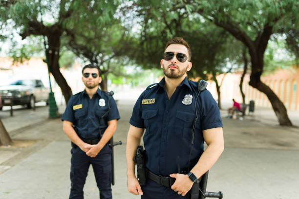 istock Police agents with sunglasses on duty working together 1423419439