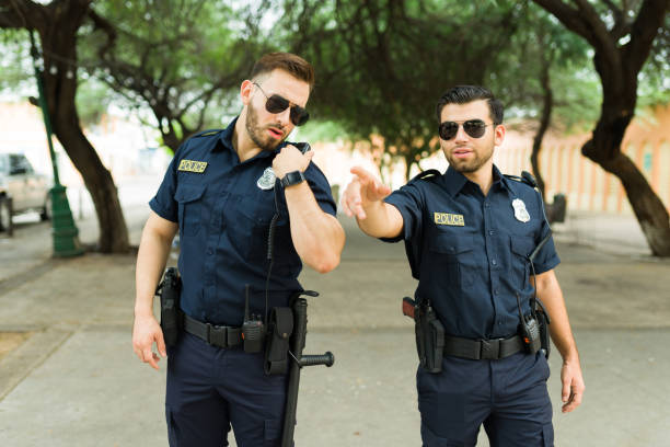 istock Busy police agents reporting a crime 1423419491