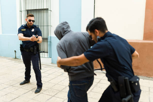 istock Angry police agents arresting a criminal robber 1423419535