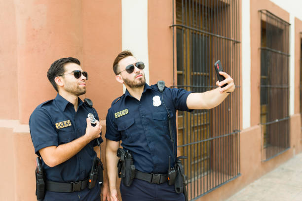 istock Police officers taking a selfie together while on duty 1423420121