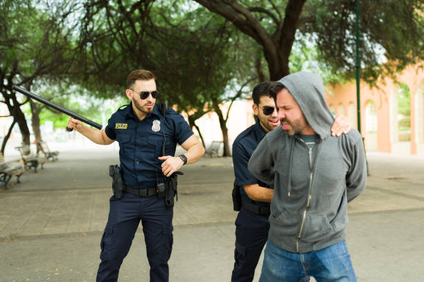 istock Criminal suspect suffering from police brutality or power abuse 1423420181