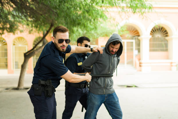 istock Suspect criminal suffering from police brutality during his arrest 1423420188