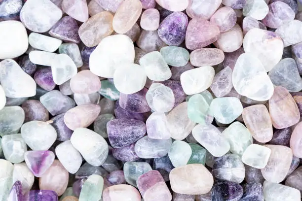 Closeup of various colorful stones quartz, marbles, ore minerals, gems use as ornament and decoration jewelry that contain spiritual force human believes
