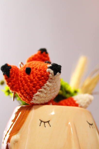 istock Little Amigurumi Fox in a Decoration 1423422159