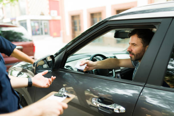 istock Driving bribing a police officer for a parking fine 1423424486