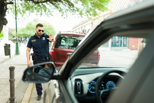 istock Angry police officer stopping a bad driver 1423425569