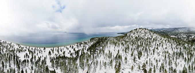 High quality aerial photos of snowfall on Lake Tahoe after a recent storm.