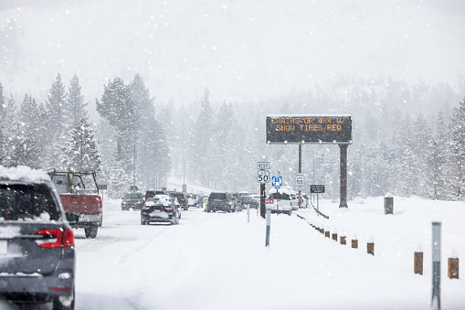 High quality stock photos of cars pulling over to put on chains before crossing Echo Summit leaving Lake Tahoe.