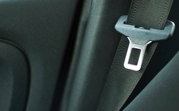 Close up of the safety belt of an airliner on a blue seat.