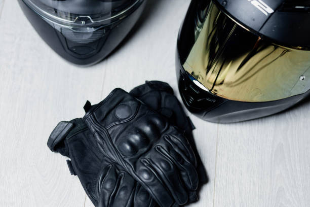 istock motorcycle equipment, leather gloves and helmets 1423436707
