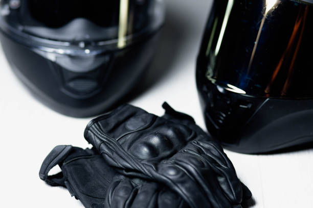 istock motorcycle equipment, leather gloves and helmets 1423436710