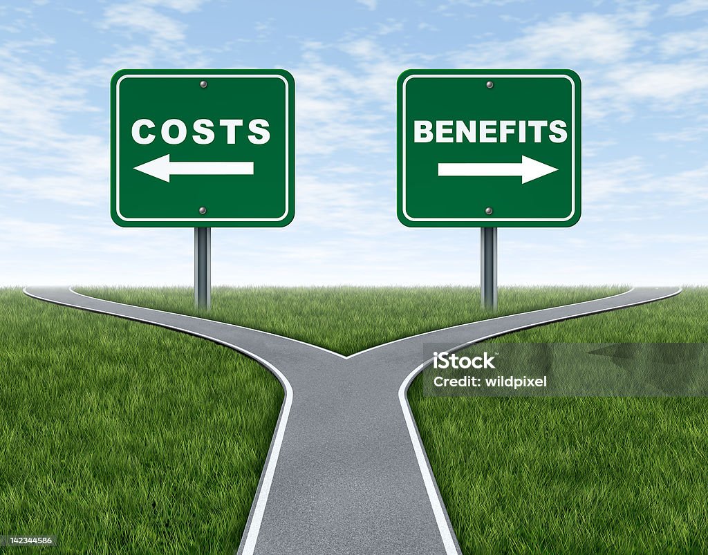 Costs and benefits Costs and benefits dilemma at a cross road or forked highway representing the difficult choice between choosing negative or positive outlook. Forked Road Stock Photo