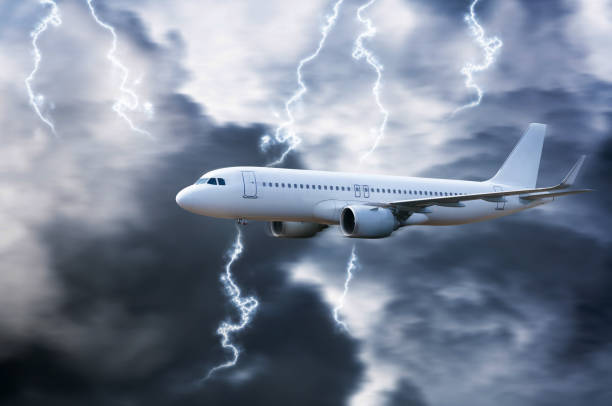 istock Airplane in the sky with thunder and lightning,The plane flies in terrible thunderstorm,Concept of climate weather 1423448457