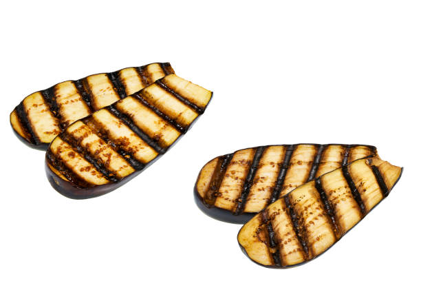 grilled sliced eggplants isolated on white background stock photo