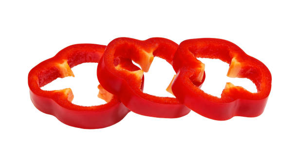 istock Red sweet bell pepper slices isolated on white background. Clipping Path 1423448976