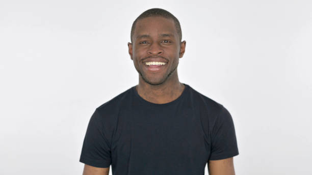 istock Young African Man Smiling at Camera on White Background 1423450050