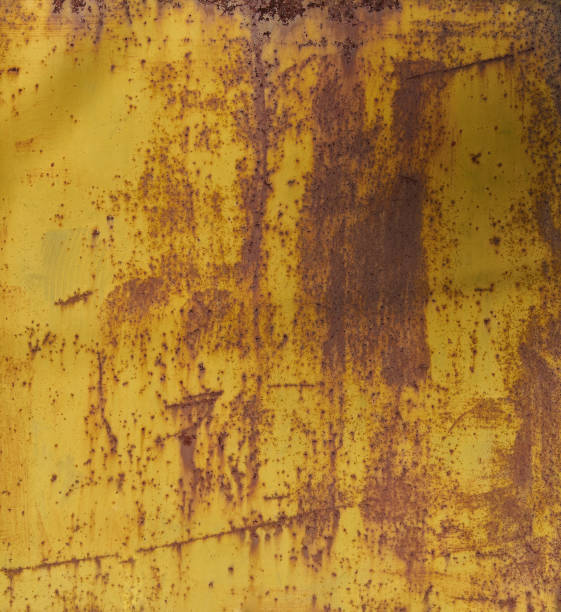 istock Old yellow painted wall with rust texture. Grunge rusted metal background. 1423450168