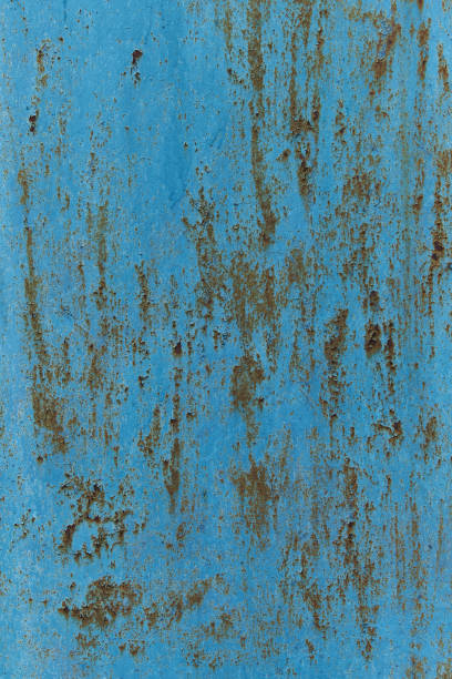 istock Rusty painted metal surface on wall background. Pattern of rustic blue grunge material. Vertical arrangement. 1423450189