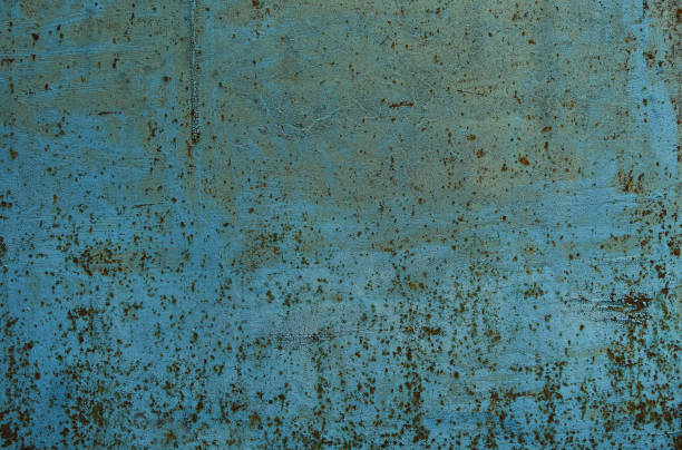 istock Rust stains on the metal surface. Rusted blue painted metal wall. 1423450216