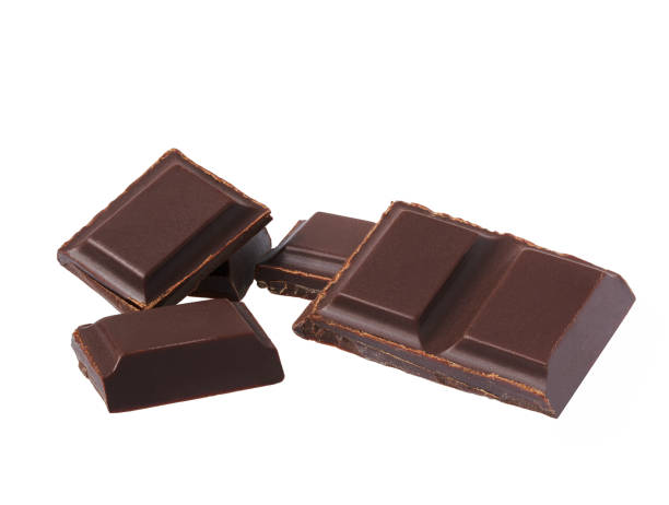 istock Dark chocolate pieces isolated on white background. 1423451797