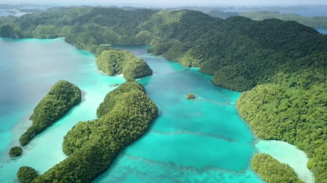 Aerial footage of a limestone islands in Rock Islands, Palau.