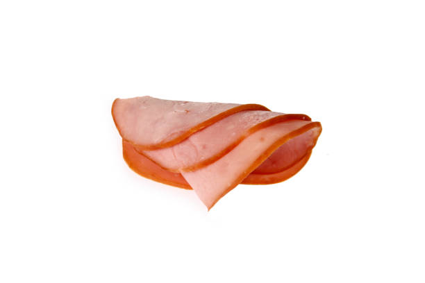 istock Pork ham slices isolated on white background 1423453071