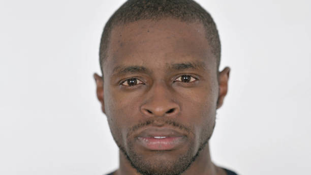 istock Face Close Up of Serious Young African Man 1423453185