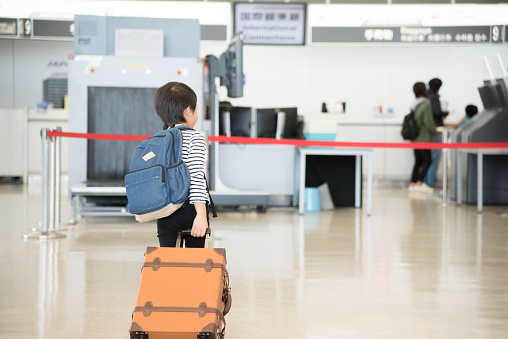 Japanese child heading for a trip