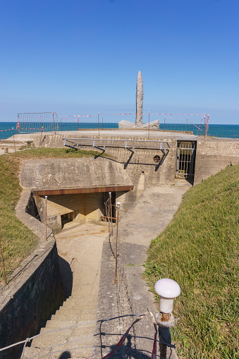 A German World War II bunker is positioned on a bluff above Omaha Beach in Colleville-sur-Mer, Normandy, France.