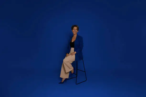 Mature Woman Business portrait on blue background