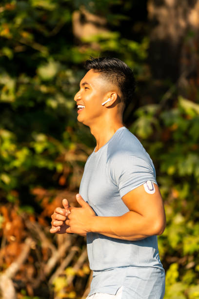 Jogger with Continuous Glucose Monitor stock photo