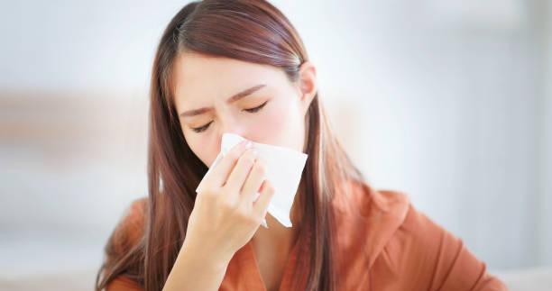 istock woman have running nose 1423459460