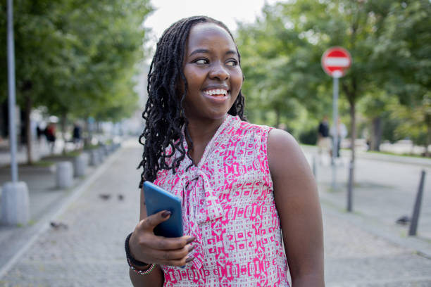 istock Happy woman using phone 1423461364