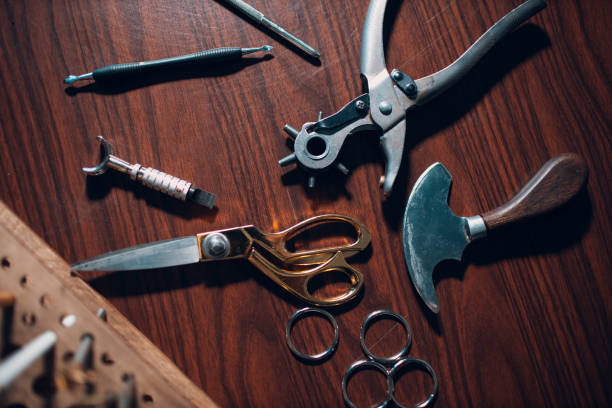 istock Tanner tools for leather goods on workshop. Working process of leather craftsman 1423471941