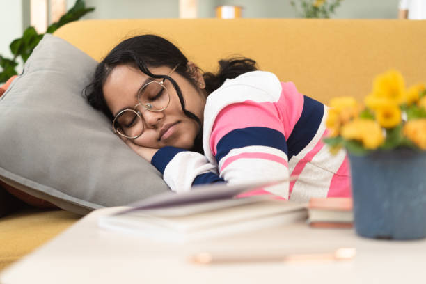 istock Beautiful girl napping on the sofa 1423472801