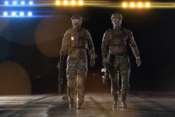 istock soldiers squad in night mission 1423481750