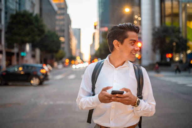 istock Young Adult Hispanic Businessman Using a Phone 1423481850