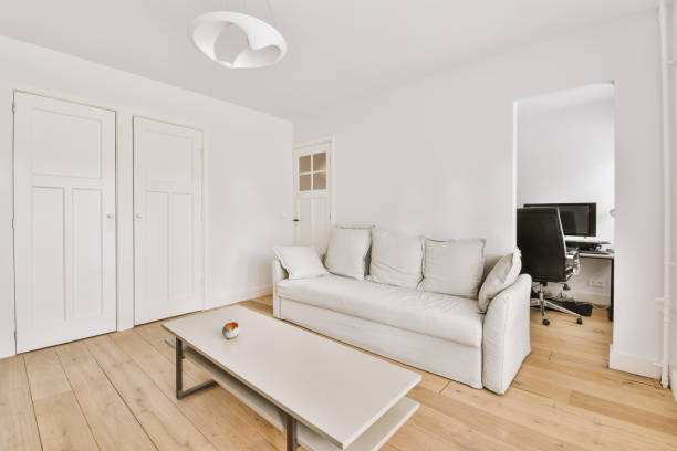 istock A small living room with a large white sofa 1423484022