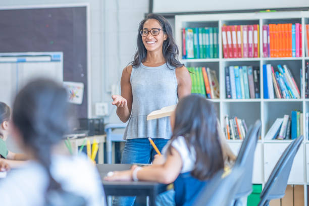 istock Montessori Teacher Working Through a Lesson 1423486598