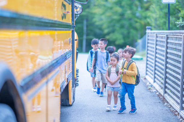 istock Children getting onto a School Bus 1423488630