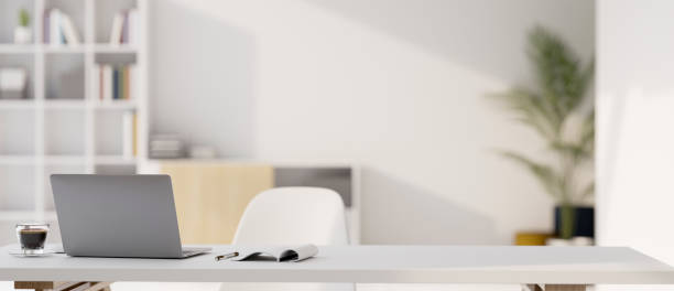 istock Modern minimal white office room, white desk workspace with notebook laptop and copy space 1423498288