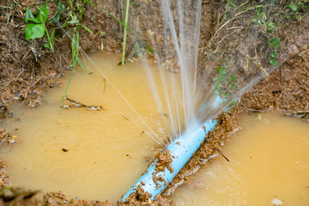 istock Water pipe break,leaking from hole in a hose  connection joint of plastic pipes Water supply system,selective focus 1423498902