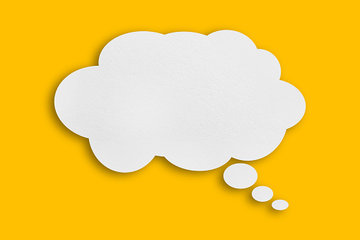Blank white chat bubble on yellow background. Horizontal composition with copy space.